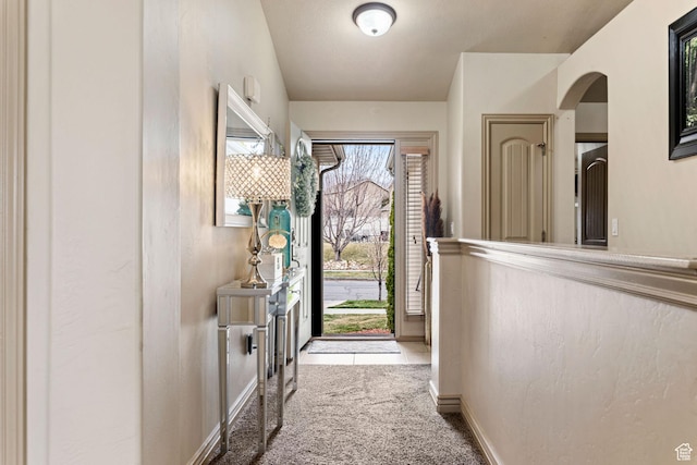 7989 S Bury Rd, West Jordan, UT 84081 - entrance foyer featuring carpet floors, arched walkways, and baseboards