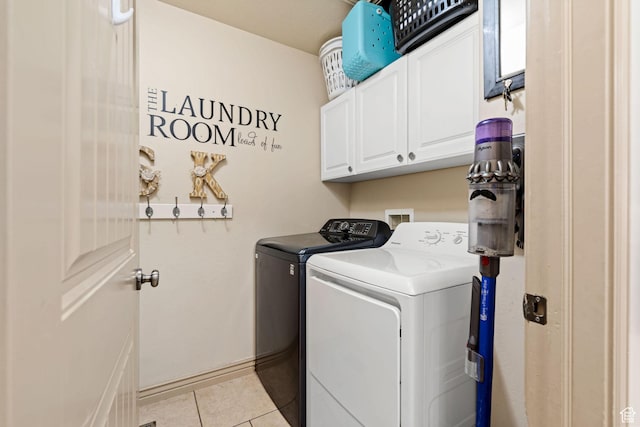 7989 S Bury Rd, West Jordan, UT 84081 - clothes washing area with light tile patterned flooring, cabinet space, and washer and clothes dryer