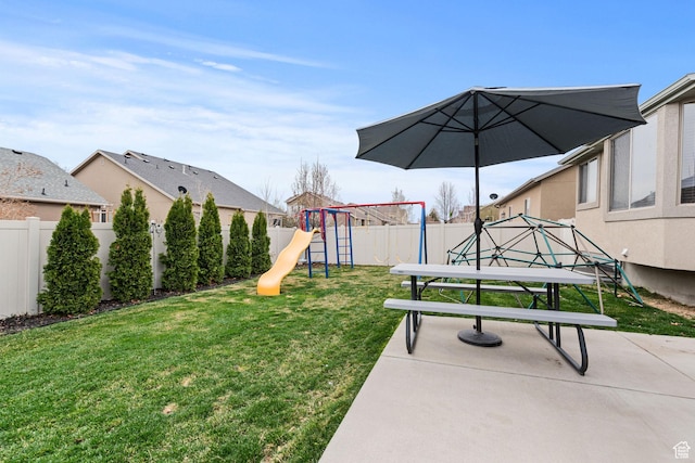 7989 S Bury Rd, West Jordan, UT 84081 - view of yard featuring a fenced backyard, a patio, and a playground