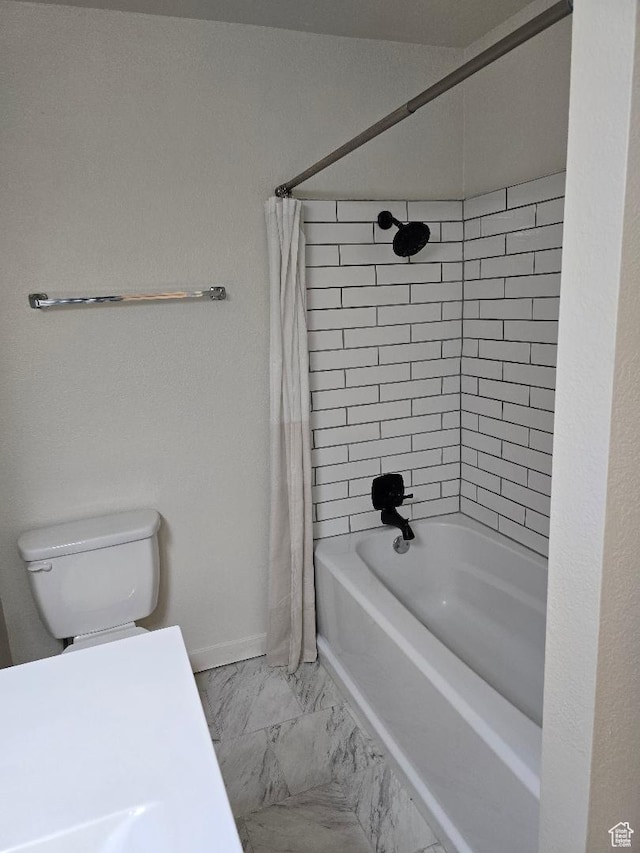 1039 E Quail Vista Ln Unit A, Millcreek, UT 84117 - bathroom featuring marble finish floor, shower / bathtub combination with curtain, toilet, and baseboards