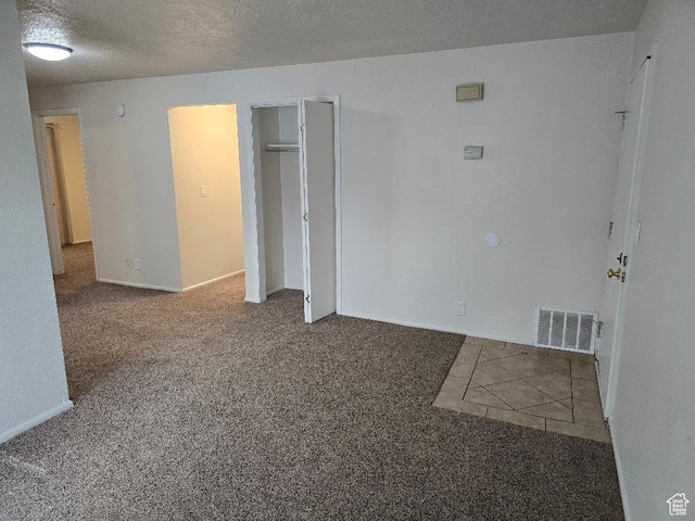 1039 E Quail Vista Ln Unit A, Millcreek, UT 84117 - empty room featuring visible vents, carpet, and a textured ceiling