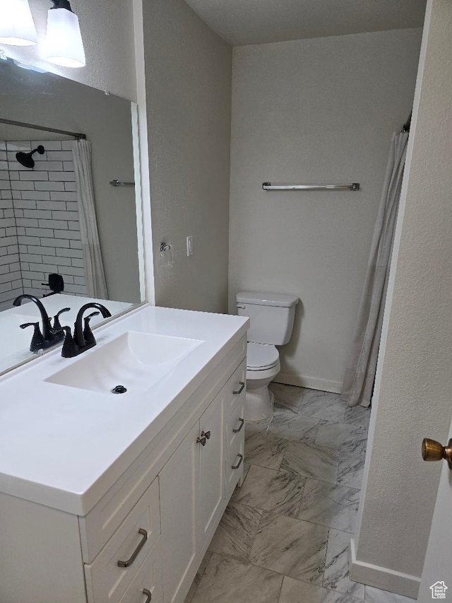 1039 E Quail Vista Ln Unit A, Millcreek, UT 84117 - full bathroom featuring toilet, vanity, a shower with curtain, marble finish floor, and baseboards