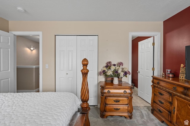 bedroom featuring a closet and carpet flooring