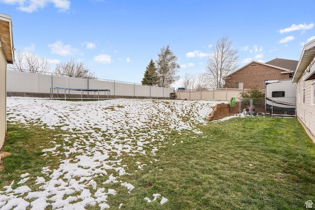 view of yard featuring a fenced backyard and a trampoline