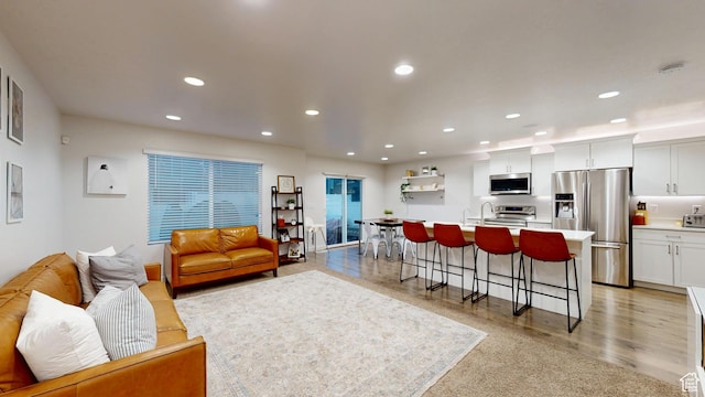 14952 S Messi St, Herriman, UT 84096 - living area featuring light wood-style floors and recessed lighting