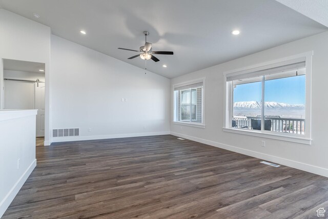437 N 800 E, Hyde Park, UT 84318 - empty room with lofted ceiling, a ceiling fan, visible vents, and a barn door