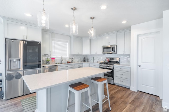 437 N 800 E, Hyde Park, UT 84318 - kitchen featuring tasteful backsplash, a kitchen breakfast bar, stainless steel appliances, and a sink