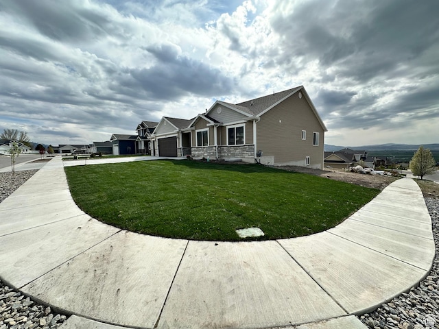 437 N 800 E, Hyde Park, UT 84318 - view of side of property featuring a lawn, driveway, and a garage