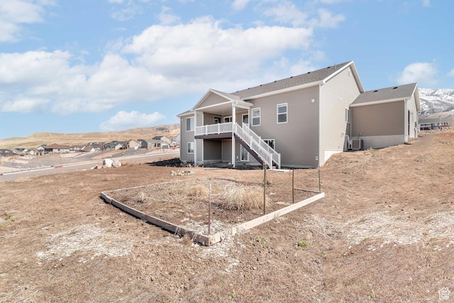 437 N 800 E, Hyde Park, UT 84318 - rear view of house featuring central air condition unit, stairway, and a mountain view