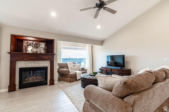 981 Eastridge Dr, Logan, UT 84321 - living area with a glass covered fireplace, ceiling fan, light wood finished floors, lofted ceiling, and recessed lighting