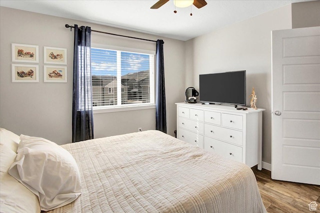5197 W Copeland Dr S, Herriman, UT 84096 - bedroom with wood finished floors and a ceiling fan