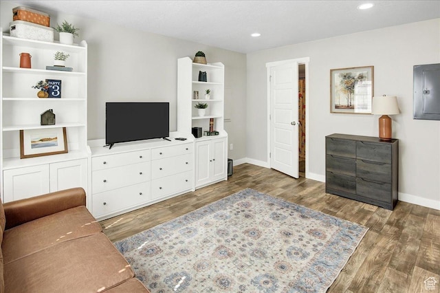5197 W Copeland Dr S, Herriman, UT 84096 - living room featuring baseboards, recessed lighting, wood finished floors, and electric panel