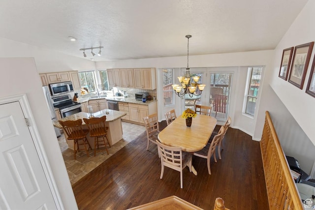 846 E Holroyd S, South Ogden, UT 84403 - dining area featuring an inviting chandelier, plenty of natural light, and lofted ceiling