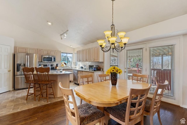 846 E Holroyd S, South Ogden, UT 84403 - dining area with an inviting chandelier, light wood-style flooring, and vaulted ceiling