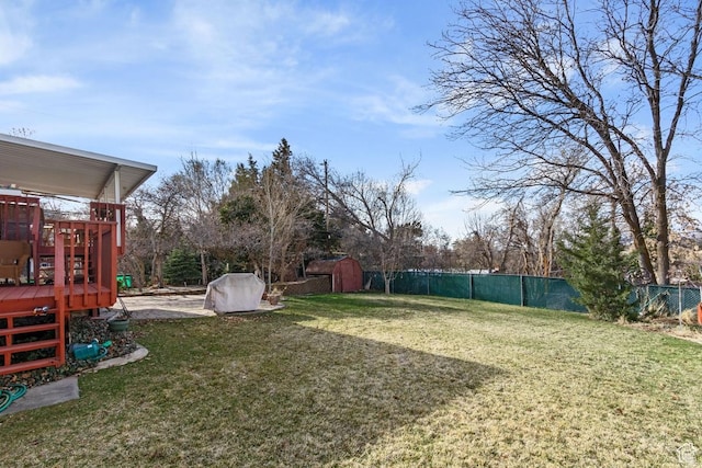 846 E Holroyd S, South Ogden, UT 84403 - view of yard with an outbuilding, a storage unit, a fenced backyard, and a deck