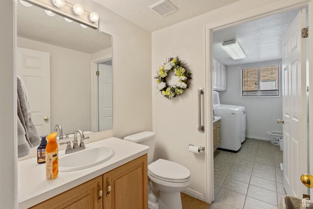 846 E Holroyd S, South Ogden, UT 84403 - bathroom featuring visible vents, independent washer and dryer, toilet, and vanity