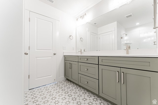 3671 W 950 N Unit 218, Lehi, UT 84043 - bathroom with double vanity, a shower with shower door, and tile patterned floors