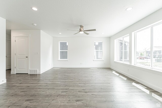 3671 W 950 N Unit 218, Lehi, UT 84043 - spare room featuring a ceiling fan, recessed lighting, wood finished floors, a textured ceiling, and a smoke detector