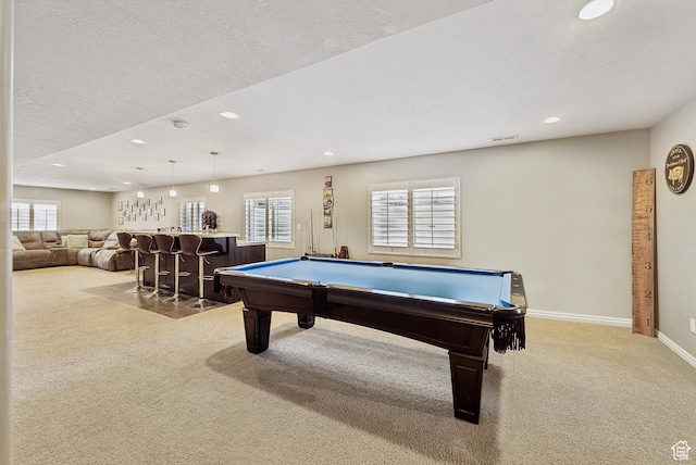 game room featuring a wealth of natural light, billiards, bar, and carpet floors