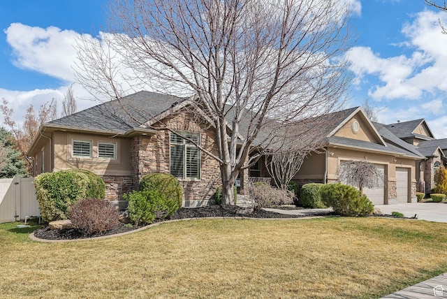 single story home with an attached garage, stone siding, fence, stucco siding, and a front lawn
