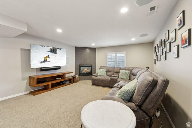 carpeted living area with baseboards, visible vents, and recessed lighting
