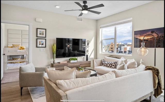 875 W Akoya Pearl St Unit 303, St George, UT 84790 - living area with visible vents, wood finished floors, and ceiling fan