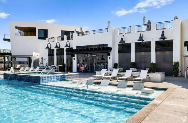 875 W Akoya Pearl St Unit 303, St George, UT 84790 - view of swimming pool with a community hot tub and a patio