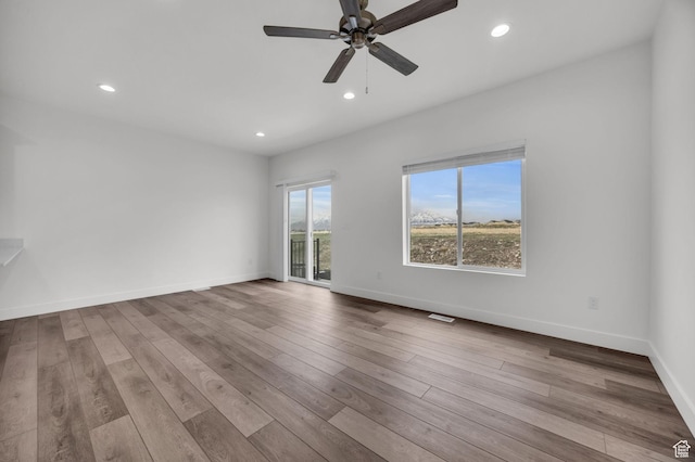 864 N Gleneagles Ct W, Tooele, UT 84074 - empty room with wood finished floors, baseboards, visible vents, ceiling fan, and recessed lighting