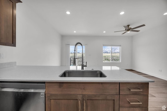 864 N Gleneagles Ct W, Tooele, UT 84074 - kitchen featuring recessed lighting, stainless steel dishwasher, a sink, a ceiling fan, and wood finished floors