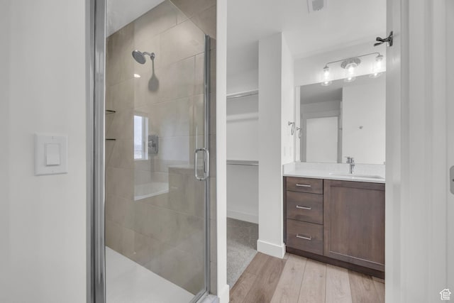 864 N Gleneagles Ct W, Tooele, UT 84074 - full bathroom with a stall shower, wood finished floors, and vanity