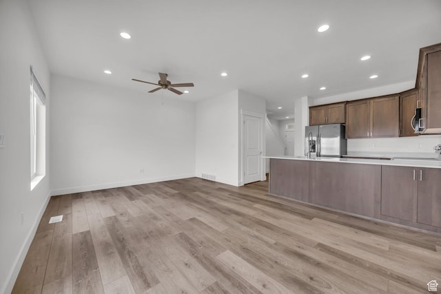 864 N Gleneagles Ct W, Tooele, UT 84074 - kitchen with light wood finished floors, recessed lighting, appliances with stainless steel finishes, and a ceiling fan