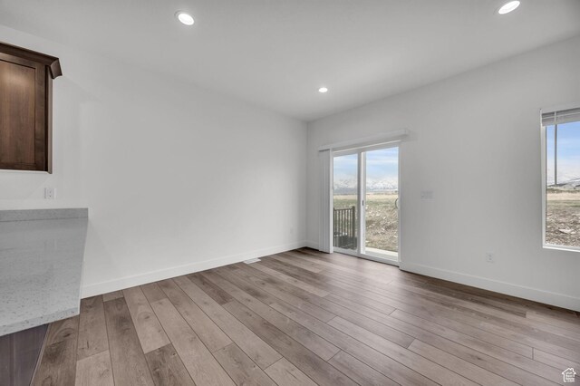 864 N Gleneagles Ct W, Tooele, UT 84074 - spare room with baseboards, wood finished floors, and recessed lighting