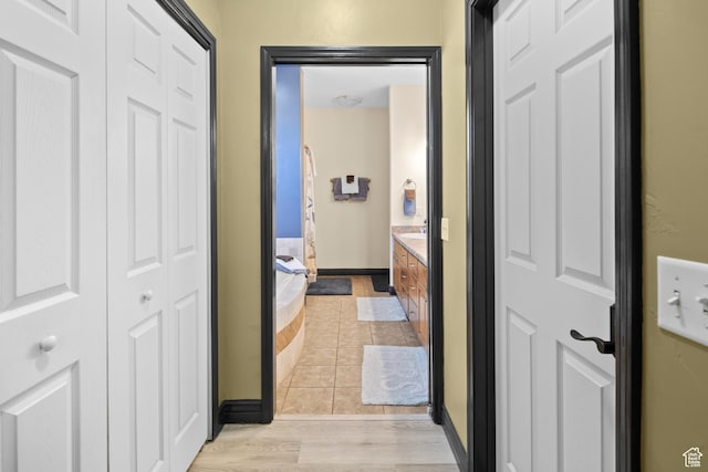 98 E Mt Peale Dr, Moab, UT 84532 - corridor with light tile patterned flooring and baseboards