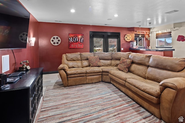 98 E Mt Peale Dr, Moab, UT 84532 - living room featuring visible vents, light wood-style flooring, and recessed lighting