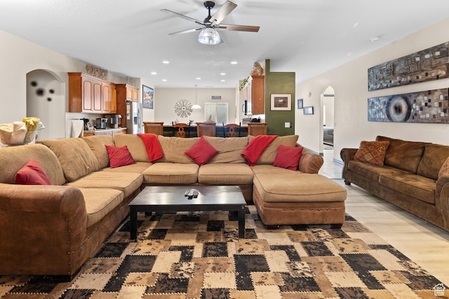 98 E Mt Peale Dr, Moab, UT 84532 - living room featuring arched walkways, ceiling fan, recessed lighting, and light wood-style floors