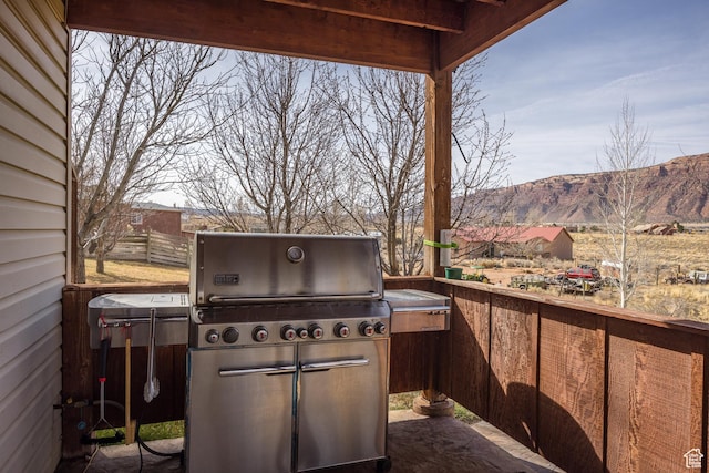 98 E Mt Peale Dr, Moab, UT 84532 - view of patio / terrace featuring grilling area, a mountain view, and fence