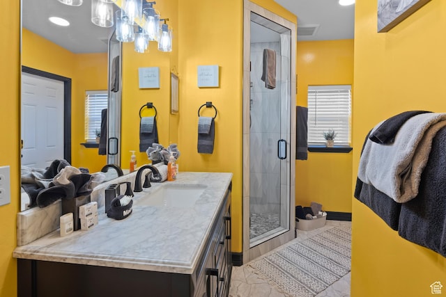 98 E Mt Peale Dr, Moab, UT 84532 - full bathroom with a stall shower, baseboards, visible vents, and vanity