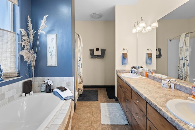 98 E Mt Peale Dr, Moab, UT 84532 - bathroom with a garden tub, double vanity, a sink, and tile patterned floors