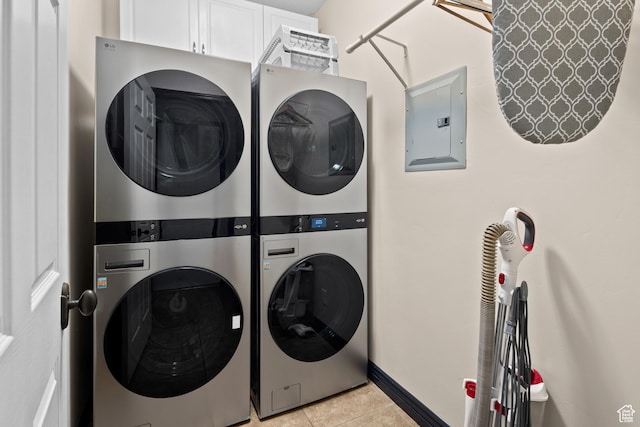 98 E Mt Peale Dr, Moab, UT 84532 - laundry area featuring electric panel, light tile patterned flooring, stacked washing maching and dryer, and laundry area