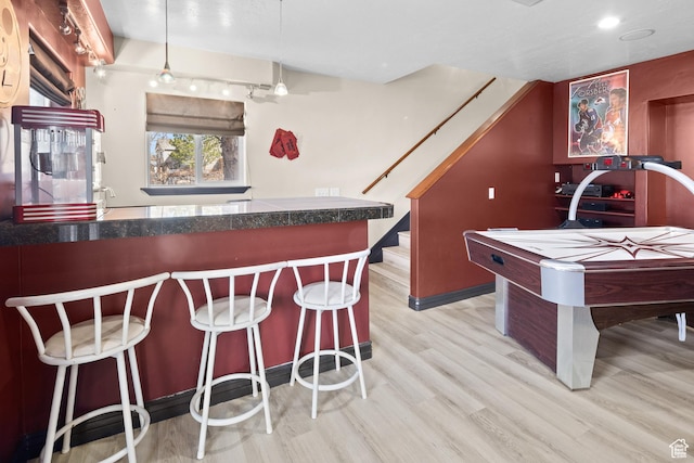 98 E Mt Peale Dr, Moab, UT 84532 - interior space with stairs, wood finished floors, a dry bar, and recessed lighting