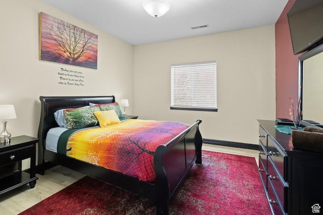 98 E Mt Peale Dr, Moab, UT 84532 - bedroom featuring wood finished floors, baseboards, and visible vents