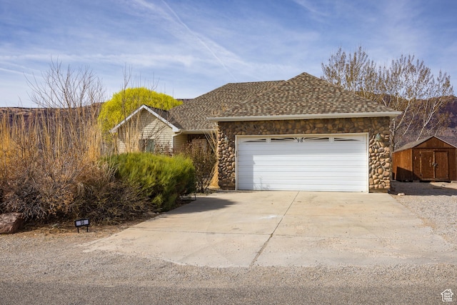 98 E Mt Peale Dr, Moab, UT 84532 - ranch-style house featuring stone siding, concrete driveway, a garage, and a shingled roof