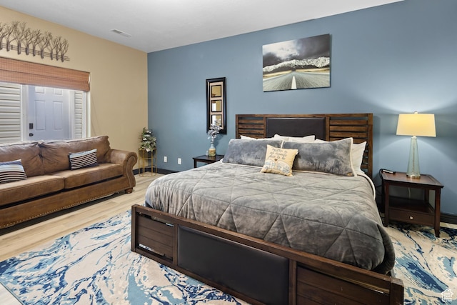 98 E Mt Peale Dr, Moab, UT 84532 - bedroom featuring baseboards, visible vents, and wood finished floors
