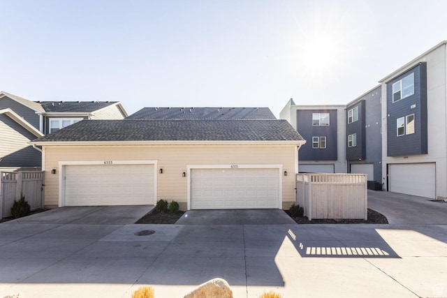 6321 W Moon Valley Dr, South Jordan, UT 84009 - view of property with a garage, driveway, fence, and a shingled roof