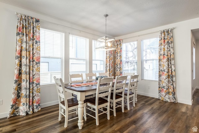 6321 W Moon Valley Dr, South Jordan, UT 84009 - dining space featuring dark wood-type flooring, baseboards, and plenty of natural light