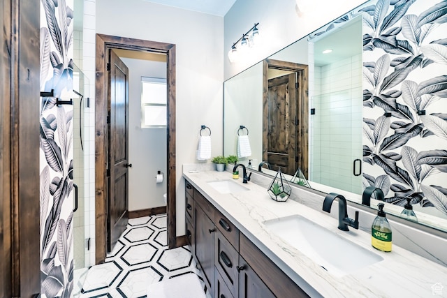 5024 W Nashoba Trl Unit 74, Hurricane, UT 84737 - full bathroom with double vanity, tile patterned flooring, a shower stall, and a sink