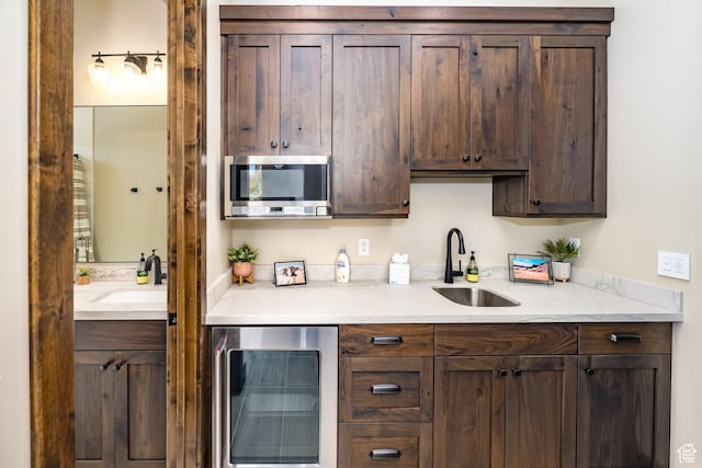 5024 W Nashoba Trl Unit 74, Hurricane, UT 84737 - kitchen with a sink, dark brown cabinetry, and beverage cooler