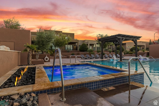 5024 W Nashoba Trl Unit 74, Hurricane, UT 84737 - community pool featuring a hot tub, a pergola, and a patio area