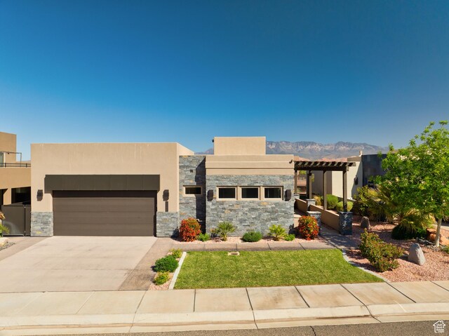 5024 W Nashoba Trl Unit 74, Hurricane, UT 84737 - contemporary house with concrete driveway, stone siding, stucco siding, and an attached garage
