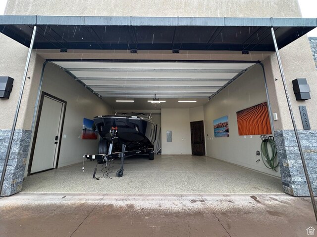 5024 W Nashoba Trl Unit 74, Hurricane, UT 84737 - garage featuring a garage door opener